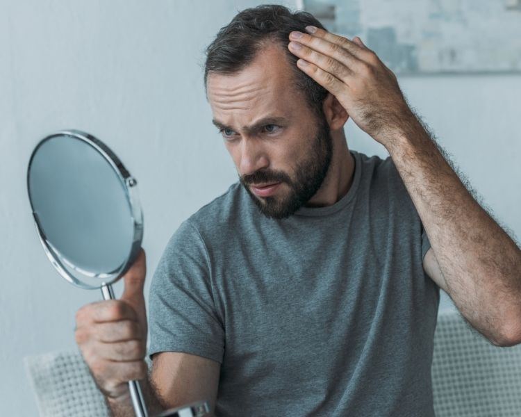 a man trying to understand the stage of hair loss